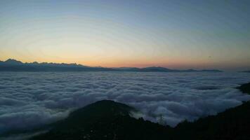 Dawn in Nepal, flying above the clouds video