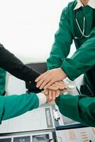 Team Doctors nurses union coordinate hands Teamwork Concept in hospital for success and trust in team. photo