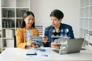 Business team hand Project manager working and update tasks and Gantt chart scheduling virtual diagram.with smart phone, tablet and laptop in office. photo