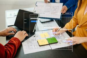 UX graphic designer planning application process development prototype wireframe for web smart phone. Creative digital development agency. photo