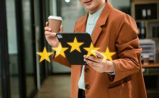 Customer or client the stars to complete five stars. with copy space. giving a five star rating. Service rating, satisfaction concept. in office photo