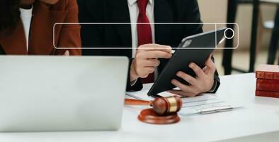 Searching Browsing Internet Data Information Networking Concept with blank search bar.justice and law concept.Male judge in a courtroom with the gavel,working with digital tablet computer. photo