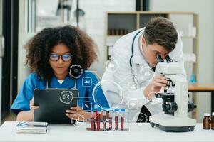 Medical Research Laboratory Portrait of Two African American Scientists Working Using Digital Tablet Analyzin Medicine Biotechnology with VR icon photo