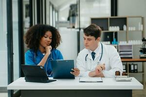 Medical technology network team meeting concept. Doctor hand working with smart phone modern digital tablet and laptop computer photo