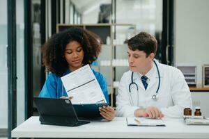 Medical technology network team meeting concept. Doctor hand working with smart phone modern digital tablet and laptop computer photo