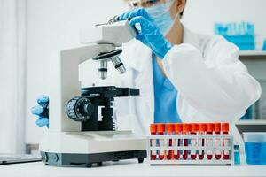 Modern medical research laboratory. female scientist working with micro pipettes analyzing biochemical samples, advanced science chemical laboratory photo