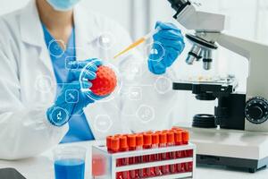 DNA molecule testing concepts. The doctor in a mask examines DNA molecules on the chemical laboratory with virtual icon photo