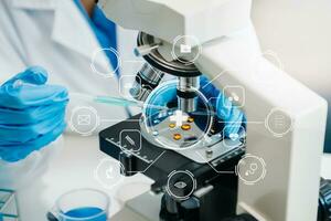 DNA molecule testing concepts. The doctor in a mask examines DNA molecules on the chemical laboratory with virtual icon photo