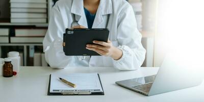 Medical technology concept. Doctor working with mobile phone and stethoscope in modern office photo