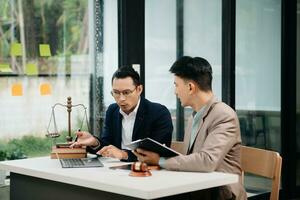 Business and Male lawyer or judge consult having team meeting with client, Law and Legal services concept.Customer service good cooperation in office photo