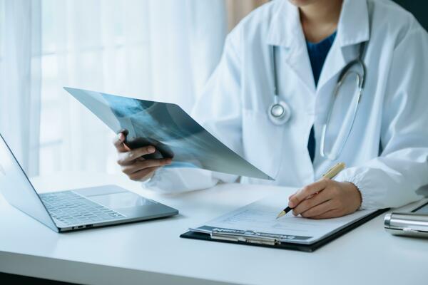 woman doctor showing x-ray lap sheet and explain the details to patient via  video call system at the hospital. 29366751 Stock Photo at Vecteezy