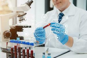 Scientist mixing chemical liquids in the chemistry lab. Researcher working in the chemical laboratory photo