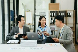 Creative managers crew working with new startup project in office. Asian Team brainstorming. photo