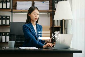 Cyber security concept, Login, User, identification information security and encryption, secure access to user's personal information woman using smart phone and tablet in office photo