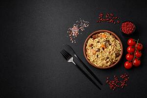 Delicious Uzbek pilaf with chicken, carrots, barberry, spices and herbs photo