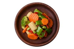 Delicious healthy vegetables steamed carrots, broccoli, asparagus beans photo