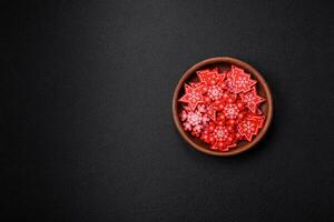 Empty ceramic black plate with christmas decoration elements photo