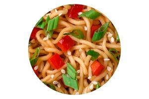 Delicious fresh Asian noodles with vegetables, salt, spices and herbs photo