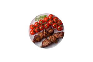 Delicious grilled chicken, turkey or pork skewers with salt, spices and herbs photo