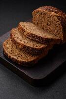 Delicious fresh crispy brown bread with grains and seeds photo