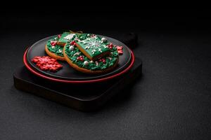 A beautiful Christmas composition consisting of ceramic plates, gingerbread and other elements photo