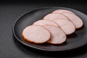 Delicious smoked chicken sausage with salt, spices and herbs photo