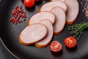Delicious smoked chicken sausage with salt, spices and herbs photo