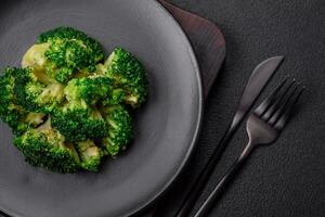 Delicious fresh green broccoli steamed in a ceramic plate photo