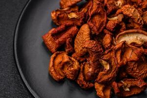 Delicious ripe red apple, sliced and dried in a special dryer photo