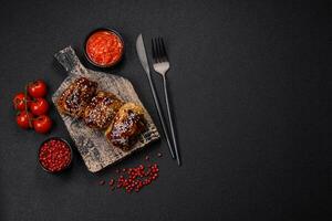 Delicious juicy fried chicken with sweet and sour teriyaki sauce and sesame seeds photo