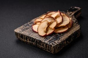 Delicious ripe red apple, sliced and dried in a special dryer photo