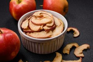 Delicious ripe red apple, sliced and dried in a special dryer photo