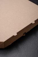 Empty cardboard rectangular brown box for delivery of delicious pizza photo