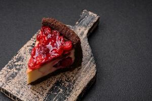 Delicious sweet cheesecake cake with mascarpone cheese, cherry berries and jam photo