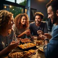 Group of friends enjoying drinks and snacks photo