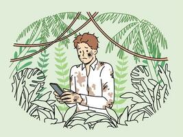 Dirty lost man office employee holding mobile phone and standing in jungle trying to send sos signal photo