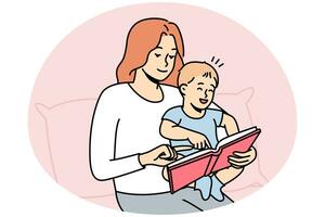 Caring mother reading book with baby photo