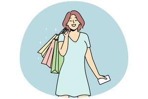Smiling woman with bags excited with shopping photo