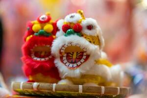 Decorated colorful lanterns hanging on a stand in the streets in Ho Chi Minh City, Vietnam during Mid Autumn Festival. Chinese language in photos mean money and happiness. Selective focus.