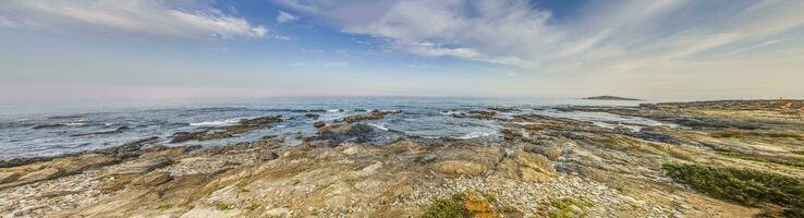 Panorama over rocky Atlantic coast in Portugal photo