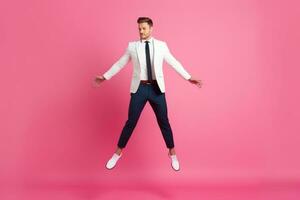 Joyful young man in full suit having fun while sitting on the chair against pink background, Generative AI photo
