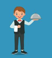 Cute little boy waiter holding silver tray serving food vector