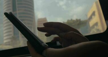 Surfing internet on cellphone in train video