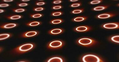 Abstract orange pattern of glowing geometric circles loop futuristic hi-tech black background photo