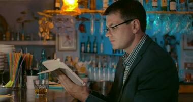 Businessman with Tablet in the Bar video