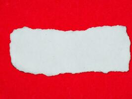 torn paper with space for text on red background photo