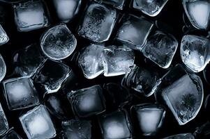 ice cubes in water on dark background photo