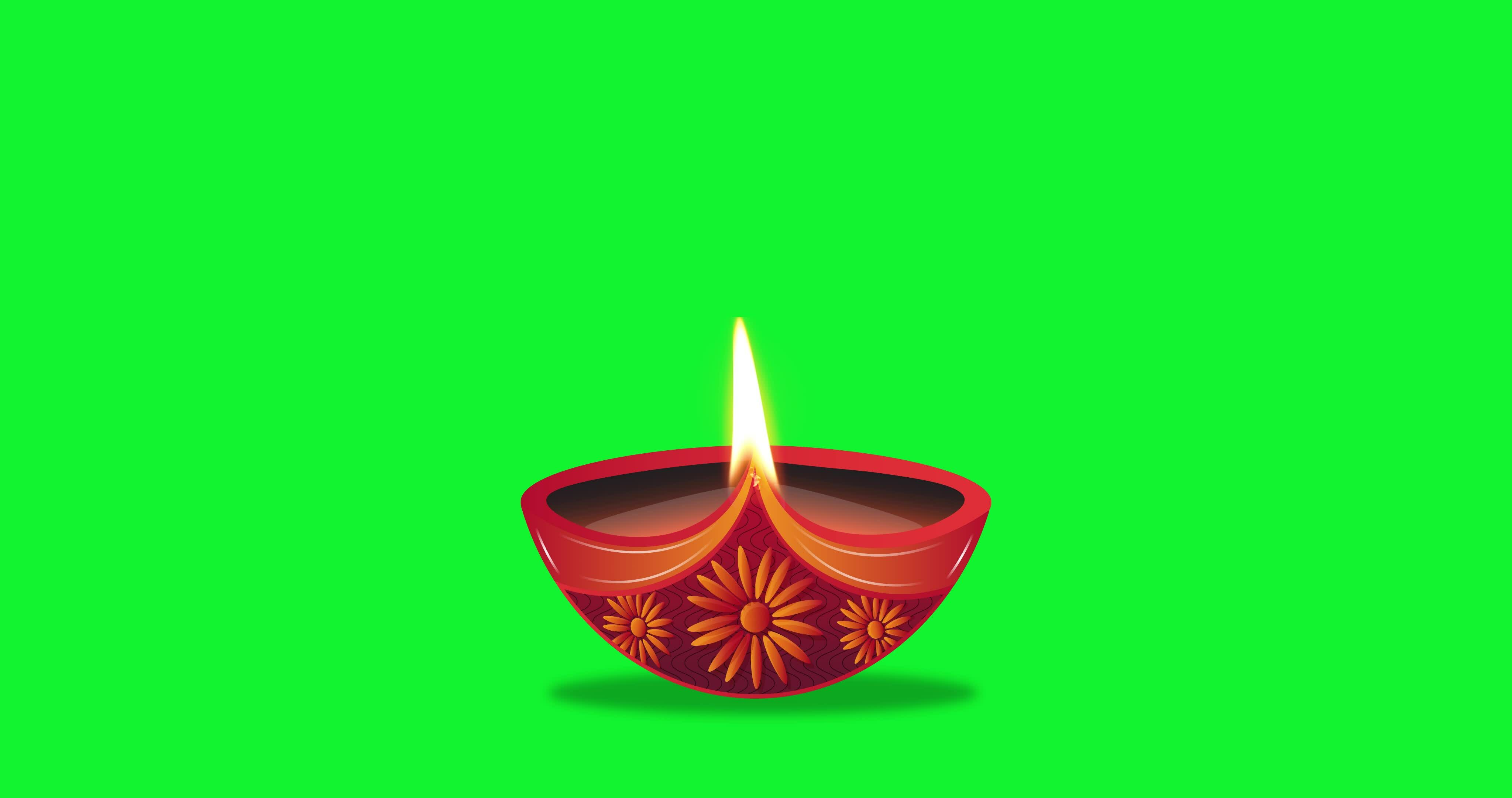 Oil lamp burning in green screen background. Diwali celebration