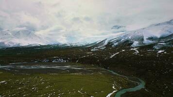 Aerial view drone flying over beautiful white snowy mountains video