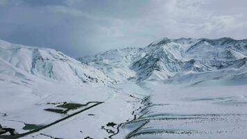 Aerial view drone flying over beautiful white snowy mountains video